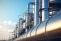 Réseau de tuyauteries en acier et cuve de stockage sur un site de production chimique.