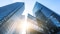 Immeubles de bureaux modernes avec des façades vitrées dans un environnement urbain.